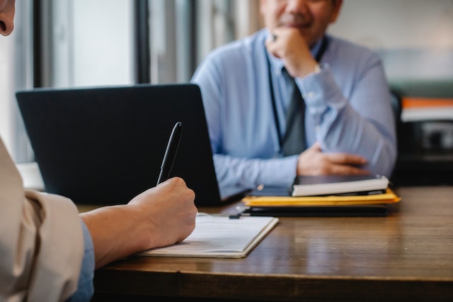 pexels-sora-shimazaki-5668858 Two people sitting across a desk working together